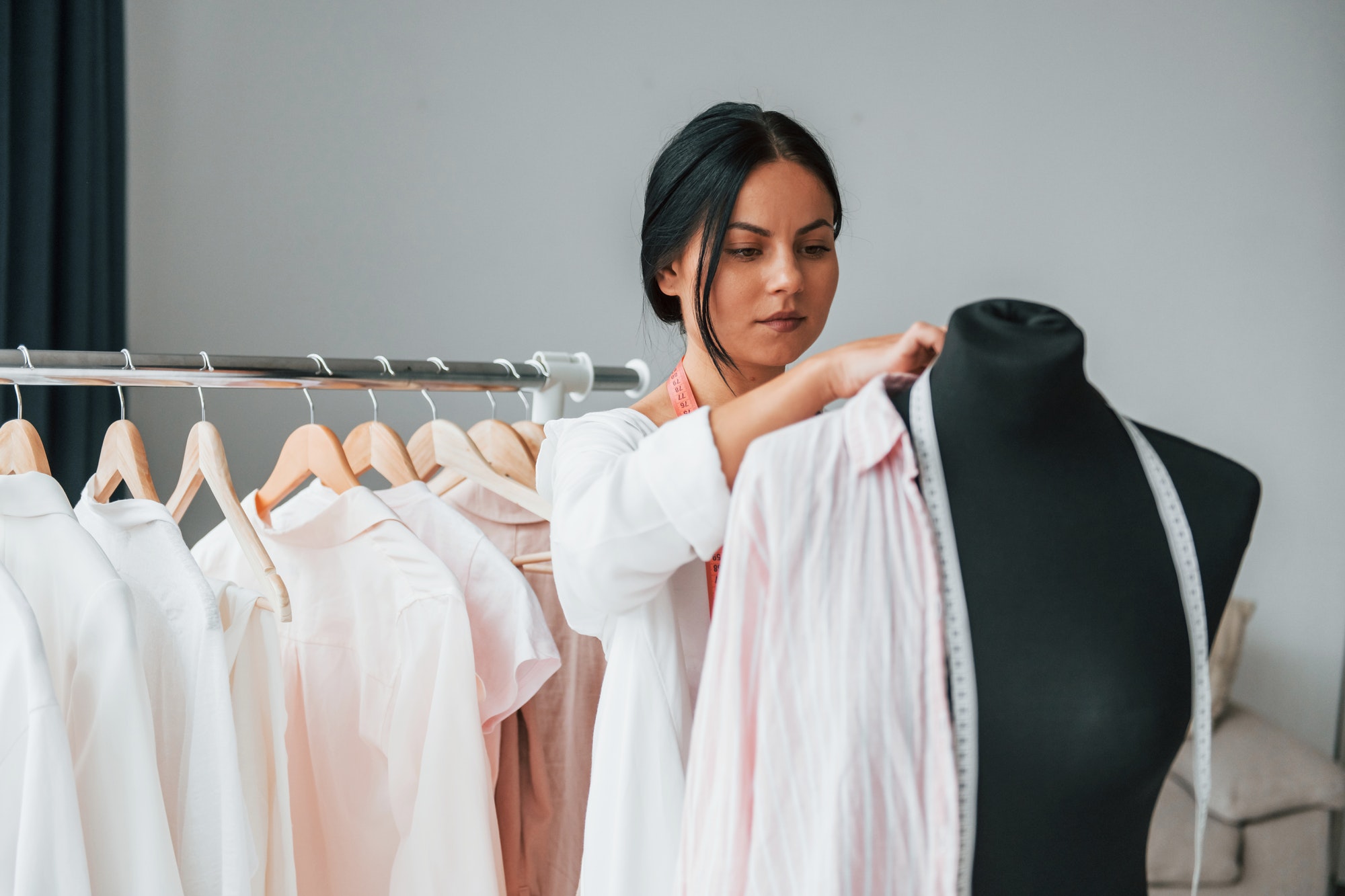 conception-of-fashion-seamstress-is-in-her-office-that-is-with-different-clothes